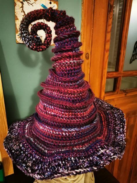 Stand out from the crowd with a one-of-a-kind crocheted twisted witch hat
